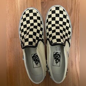 Vans black checkered slip ons